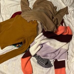 Bundle of sweaters, tee shirts, and funky flannels
